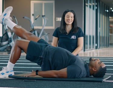 Biokineticist assisting with knee rehabilitation in Randburg