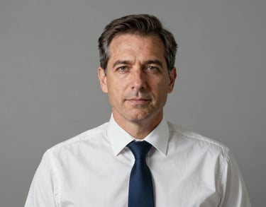 Headshot of a middle-aged professional man in a crisp white shirt and dark navy blue tie. Clean composition, professional lighting, representing leadership in a North American / US Southern context.