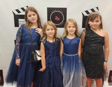 Youth participants attending a family-friendly arts event organized by Fear Fame Arts Foundation