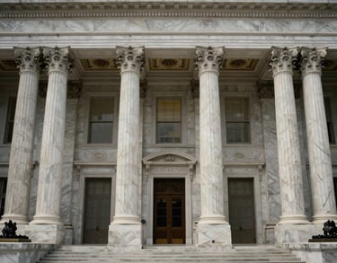 The Great Hall of a historic federal building in the US, showing towering marble columns and elegant architectural details in a symmetric composition.