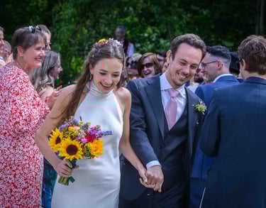 a bride and groom walking down the aisle at a wedding