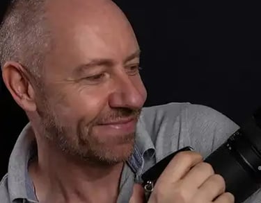 Jon Fallon wedding photographer holding a camera