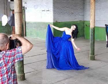 Photographer taking photographs of model in the Stone Room at Atlas Studios for their portfolio.