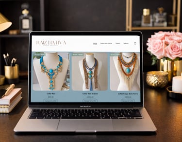 Handmade artisan necklaces displayed on a jewelry e-commerce website on a MacBook Air laptop.
