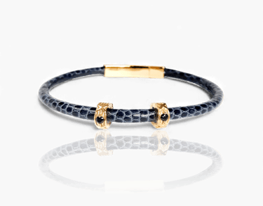 Luxury blue leather bracelet with gold accents and black crystals