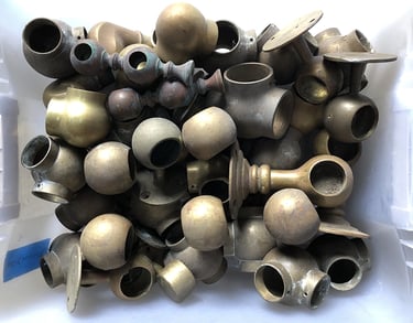 Metal parts in a sculptor's workshop bin, image 4.
