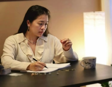 Jewelry designer sketching a custom gemstone ring design