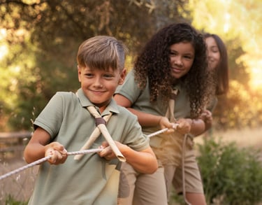 a boy scout scout scout uniform holding a stick