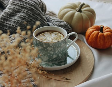a cup of coffee and a pumpkin spiced up