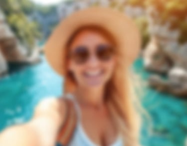 a sugar baby in a hat and sunglasses taking a selfie