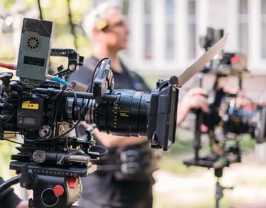 camera operator filming on location