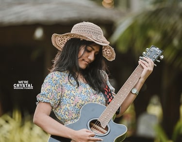 bride playing a guitar