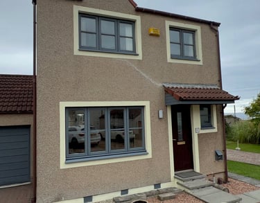 a house with a driveway and garage door