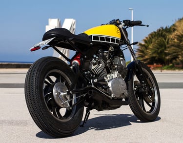 a motorcycle parked on the street in front of a building