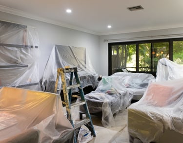 prepped and draped room with contractor tools