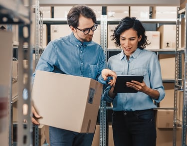 a man and woman in a warehouse setting