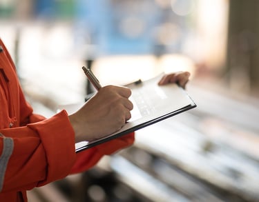 a person in a red jacket and a pen and a pen