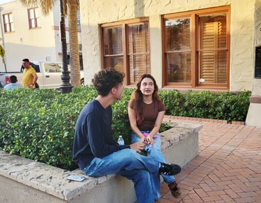 A man & a woman talking 