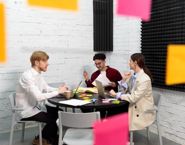 a group of people sitting around a table