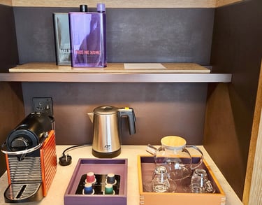 Andaz Singapore room amenities with reusable water bottle and complimentary coffee and tea