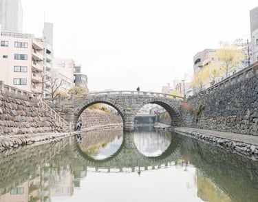 Megane Bridge reflected in the river forming the shape of glasses in Nagasaki