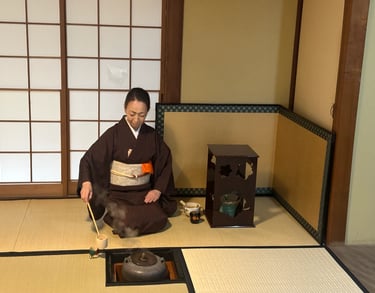 Tea ceremony master whisking matcha during a traditional tea ceremony