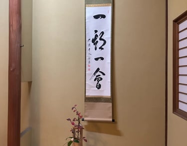 Calligraphy scroll displayed in a traditional Japanese tea room