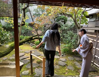Traditional Japanese garden with trees, stones, and a calm atmosphere