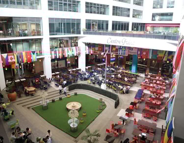 APU Main Hall with many international flags