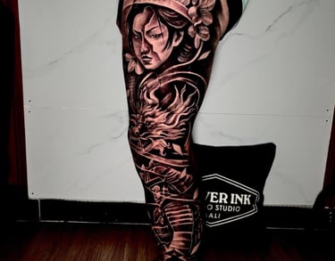 tattoo on tourist’s calf at Legian tattoo studio
