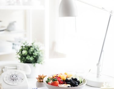 a bowl of fruit salad on a table