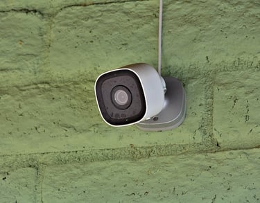 a camera mounted to a wall with a camera attached to it