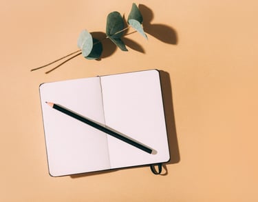 a pencil and pencil on a notebook with a pencil and a pencil
