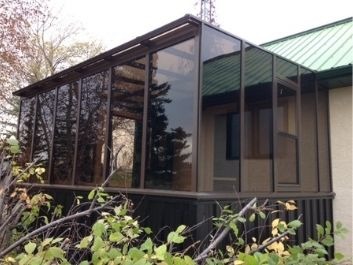Square Eave Solarium or Lean-to solarium with pony wall and brown color.