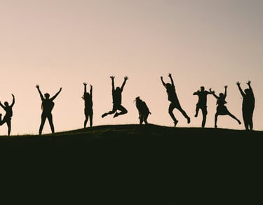 People feeling empowered, jumping for joy