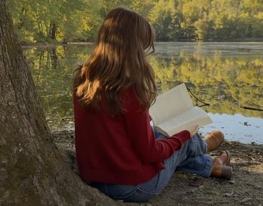 a woman sitting on a tree trunk trunk trunk trunk trunk trunk trunk trunk trunk trunk