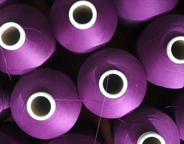 Purple yarn cones from top view