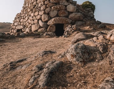 a stone wall with a small stone structure