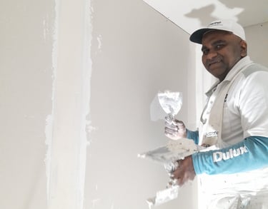 Dan plastering new gib in preparation to paint the walls