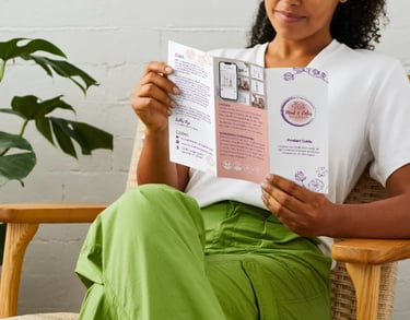 woman holding skincare brochure with mud and lotus natural and organic skincare