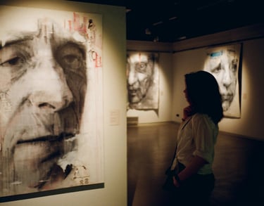 Guests browsing artworks at private preview event.