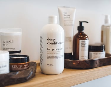 Hair care products layout, deep conditioner, natural hair products, professional salon setting, clean aesthetic
