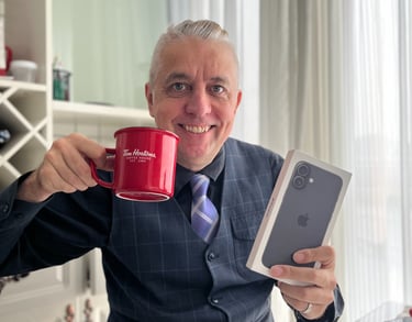 a man in a suit and tie holding a cup of coffee