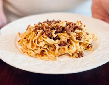 A plate of tagliatelle al ragù by Alessandra Spisni.