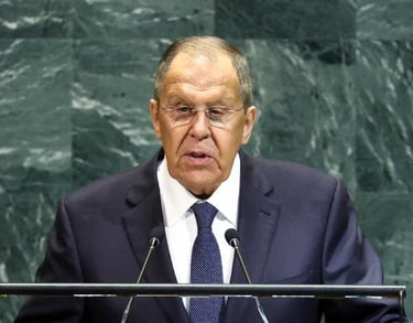 a man in a suit and tie standing at a podium