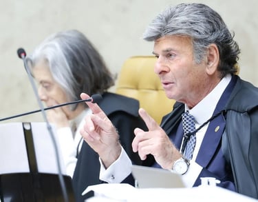 a man in a suit and tie is sitting at a table