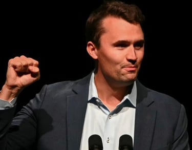 a man in a suit and tie is holding a microphone