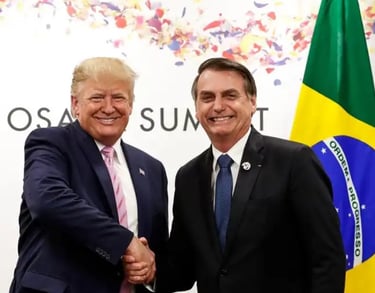 a man in a suit and tie standing next to a flag