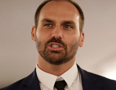 a man in a suit and tie with a black tie