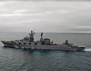 a large ship in the water with a boat in the water